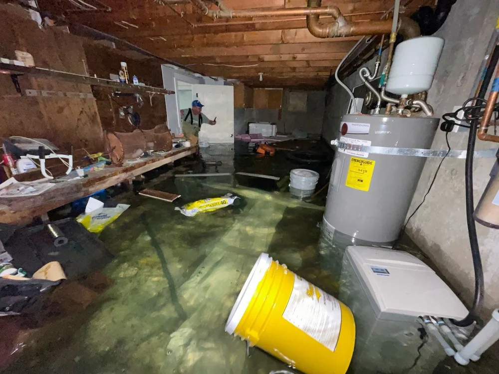 Basement flooded with standing water and debris