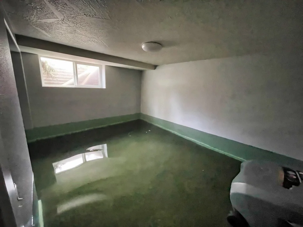 Flooded interior room with standing water