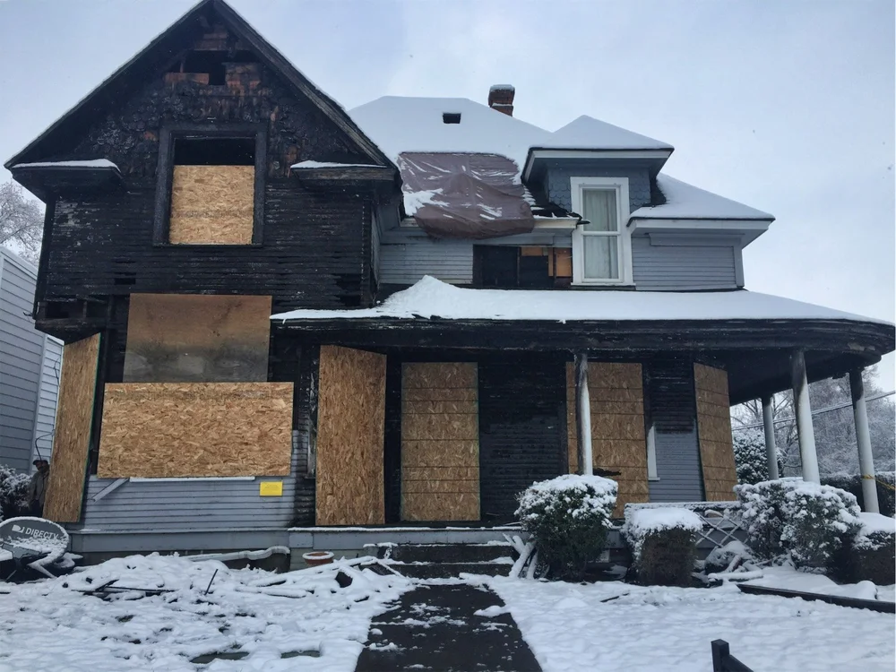Fire damaged home secured during fire restoration process