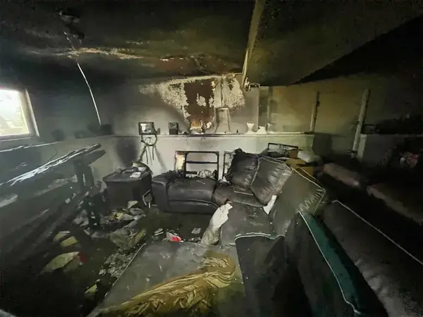 Basement den with heavy fire and smoke damage