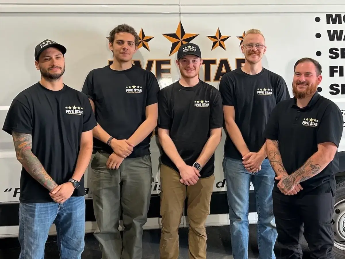 The Five Star mitigation team in front of a company van